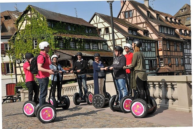 Riders on Segways in the half-timbered lanes of Petite France, Strasbourg